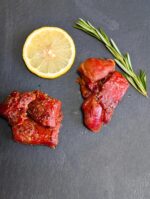 Cracked-pepper smoked salmon nuggets arranged on a serving board