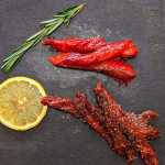 Wild Canadian smoked sockeye salmon candy and Indian pepper salmon gift duo on a serving board